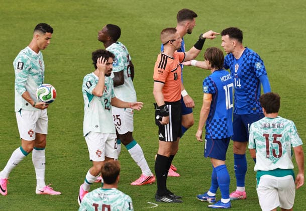 (260703) -- TORONTO, July 3, 2026 -- Referee Espen Eskas talks with Ivan Perisic (2nd R) of Croatia during the round of 32 match between Portugal and Croatia at the 2026 FIFA World Cup, WM, Weltmeisterschaft, Fussball at Toronto Stadium in Toronto, Canada, July 2, 2026. (Photo by Xinhua) (SP)CANADA-TORONTO-FOOTBALL-FIFA WORLD CUP-ROUND OF 32-POR VS CRO YangxShu 