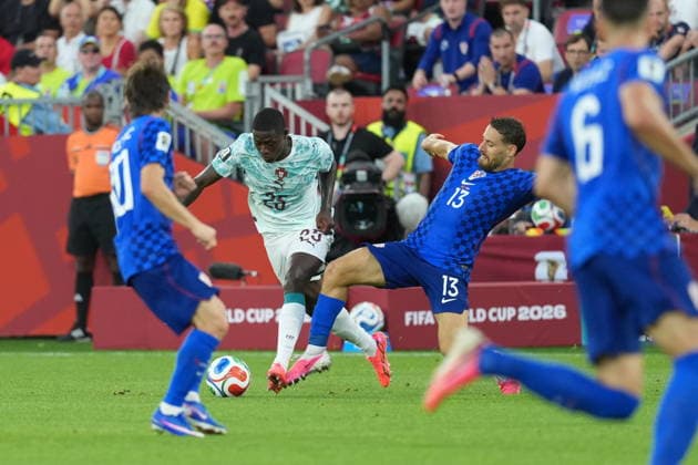 Portugal v Croatia - FIFA World Cup, WM, Weltmeisterschaft, Fussball 2026 - Round of 32 TORONTO, CANADA - JULY 02: Nikola Vlasic (13) of Croatia in action against Nuno Mendes (25) of Portugal during the 2026 FIFA World Cup First Stage Round of 32 match between Portugal and Croatia at Toronto Stadium (BMO Field) in Toronto, Ontario, Canada on July 02, 2026. Mert Alper Dervis Anadolu Ontario Canada. Editorial use only. Please get in touch for any other usage.  Copyright: x2026xAnadoluxMertxAlperxDervisx