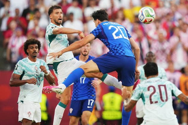 July 2, 2026, Toronto, On, CANADA: Portugal s Ruben Dias (top left) clears the ball past Croatia s Igor Matanovic (20) during the second half of a World Cup round of 32 soccer match, in Toronto on Thursday, July 2, 2026. Canada News - July 2, 2026  - ZUMAc35_ 20260702_zaf_c35_156 Copyright: xNathanxDenettex