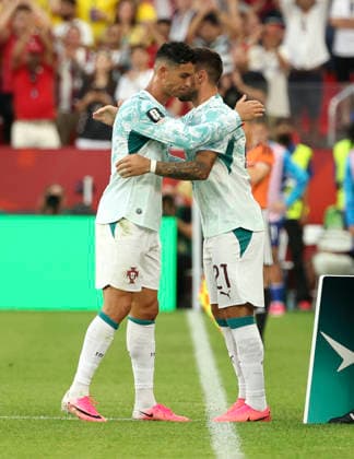 (260703) -- TORONTO, July 3, 2026 -- Cristiano Ronaldo (L) of Portugal hugs Ruben Neves of Portugal after being substituted during the round of 32 match between Portugal and Croatia at the 2026 FIFA World Cup, WM, Weltmeisterschaft, Fussball at Toronto Stadium in Toronto, Canada, July 2, 2026. (Photo by Xinhua) (SP)CANADA-TORONTO-FOOTBALL-FIFA WORLD CUP-ROUND OF 32-POR VS CRO ZouxZheng 