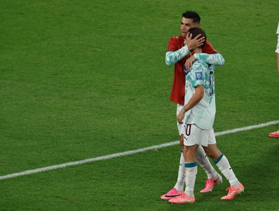 (260703) -- TORONTO, July 3, 2026 -- Cristiano Ronaldo (L) of Portugal hugs his teammate Bernardo Silva after winning the round of 32 match between Portugal and Croatia at the 2026 FIFA World Cup, WM, Weltmeisterschaft, Fussball at Toronto Stadium in Toronto, Canada, July 2, 2026. (Photo by Xinhua) (SP)CANADA-TORONTO-FOOTBALL-FIFA WORLD CUP-ROUND OF 32-POR VS CRO YangxShu 