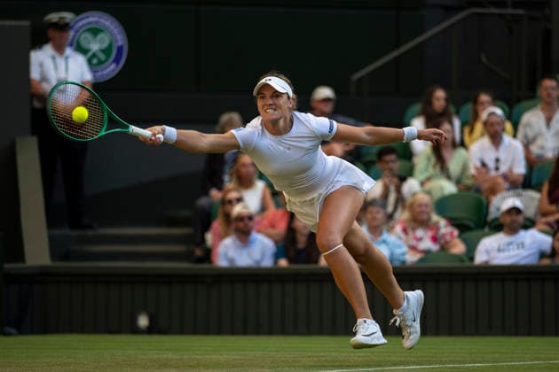 (260703) -- LONDON, July 3, 2026 -- Caty McNally of the United States returns the ball during the women s singles second round match against Elena Rybakina of Kazakhstan at the Wimbledon Tennis Championships in London, Britain, on July 2, 2026. (Photo by Xinhua) (SP)BRITAIN-LONDON-TENNIS-WIMBLEDON-WOMEN S SINGLES StephenxChung 