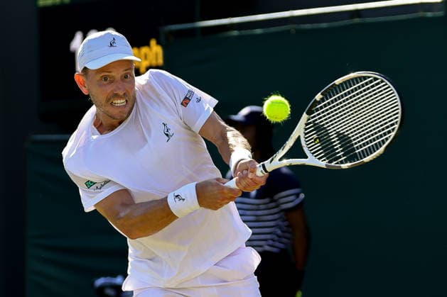 (260703) -- LONDON, July 3, 2026 -- James Duckworth of Australia returns the ball during the men s singles second round match against Flavio Cobolli of Italy at the Wimbledon Tennis Championships in London, Britain, on July 2, 2026. (Photo by Xinhua) (SP)BRITAIN-LONDON-TENNIS-WIMBLEDON-MEN S SINGLES DinendraxHaria 