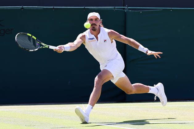 (260703) -- LONDON, July 3, 2026 -- Patrick Kypson of the United States returns the ball during the men s singles second round match against Taylor Fritz of the United States at the Wimbledon Tennis Championships in London, Britain, on July 2, 2026. (Photo by Xinhua) (SP)BRITAIN-LONDON-TENNIS-WIMBLEDON-MEN S SINGLES DinendraxHaria 