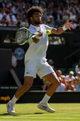 (260703) -- LONDON, July 3, 2026 -- Arthur Fils of France returns the ball during the men s singles second round match against Matteo Berrettini of Italy at the Wimbledon Tennis Championships in London, Britain, on July 2, 2026. (Photo by Xinhua) (SP)BRITAIN-LONDON-TENNIS-WIMBLEDON-MEN S SINGLES StephenxChung 