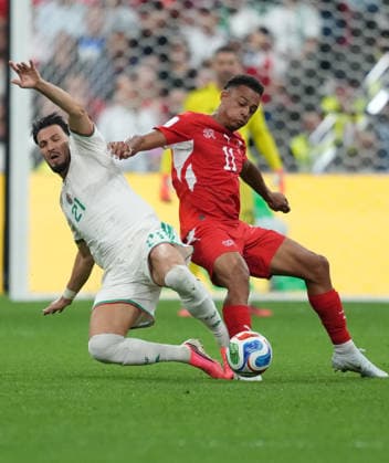(260703) -- VANCOUVER, July 3, 2026 -- Dan Ndoye (R) of Switzerland vies with Ramy Bensebaini of Algeria during the round of 32 match between Switzerland and Algeria at the 2026 FIFA World Cup, WM, Weltmeisterschaft, Fussball at BC Place Vancouver in Vancouver, Canada, July 2, 2026. ) (SP)CANADA-VANCOUVER-FOOTBALL-FIFA WORLD CUP-ROUND OF 32-SUI VS ALG MengxYongmin 