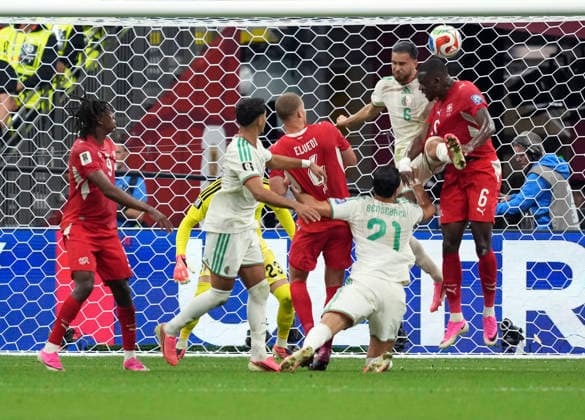 (260703) -- VANCOUVER, July 3, 2026 -- Denis Zakaria (top R) of Switzerland and Ramiz Zerrouki (top L) of Algeria fight for a head ball during the round of 32 match between Switzerland and Algeria at the 2026 FIFA World Cup, WM, Weltmeisterschaft, Fussball at BC Place Vancouver in Vancouver, Canada, July 2, 2026. ) (SP)CANADA-VANCOUVER-FOOTBALL-FIFA WORLD CUP-ROUND OF 32-SUI VS ALG MengxYongmin 