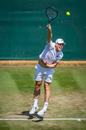 RECORD DATE NOT STATED 3rd July 2026; All England Lawn Tennis and Croquet Club, London, England; Wimbledon Tennis Tournament, Day Five; Harri Heliovaara (FIN) serves in his second round match with Henry Patten (GBR) against Mac Kiger (USA) and Patrik Trhac (USA) GodfreyxPitt
