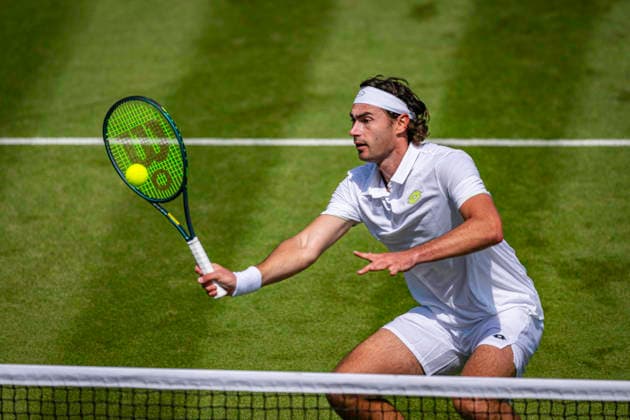 RECORD DATE NOT STATED 3rd July 2026; All England Lawn Tennis and Croquet Club, London, England; Wimbledon Tennis Tournament, Day Five; Patrik Trhac (USA) plays a volley in his second round match with Mac Kiger (USA) against Harri Heliovaara (FIN) and Henry Patten (GBR) GodfreyxPitt