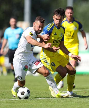 SOCCER - Sturm vs Kosice, test match IRDNING,AUSTRIA,03.JUL.26 - SOCCER - ADMIRAL Bundesliga, Nike liga, SK Sturm Graz vs FC Kosice, test match. Image shows Juergen Heil (Sturm) and Roman Cerepkai (Kosice).  GEPAxpictures xHaraldxSteiner