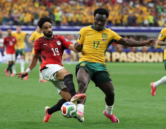 (260704) -- DALLAS, July 4, 2026 -- Nestory Irankunda (R) of Australia vies with Marawan Attia of Egypt during the round of 32 match between Australia and Egypt at the 2026 FIFA World Cup, WM, Weltmeisterschaft, Fussball at Dallas Stadium in Dallas, the United States, July 3, 2026. ) (SP)U.S.-DALLAS-FOOTBALL-FIFA WORLD CUP-ROUND OF 32-AUS VS EGY LixYing 