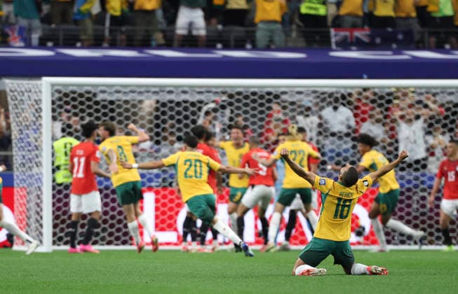 (260704) -- DALLAS, July 4, 2026 -- Aziz Behich (front) of Australia celebrates Egypt s own goal during the round of 32 match between Australia and Egypt at the 2026 FIFA World Cup, WM, Weltmeisterschaft, Fussball at Dallas Stadium in Dallas, the United States, July 3, 2026. ) (SP)U.S.-DALLAS-FOOTBALL-FIFA WORLD CUP-ROUND OF 32-AUS VS EGY LixYing 