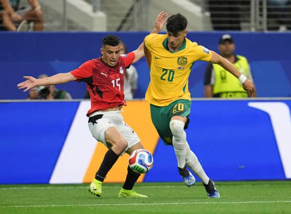 (260704) -- DALLAS, July 4, 2026 -- Cristian Volpato (R) of Australia vies with Karim Hafez of Egypt during the round of 32 match between Australia and Egypt at the 2026 FIFA World Cup, WM, Weltmeisterschaft, Fussball at Dallas Stadium in Dallas, the United States, July 3, 2026. ) (SP)U.S.-DALLAS-FOOTBALL-FIFA WORLD CUP-ROUND OF 32-AUS VS EGY WuxXiaoling 