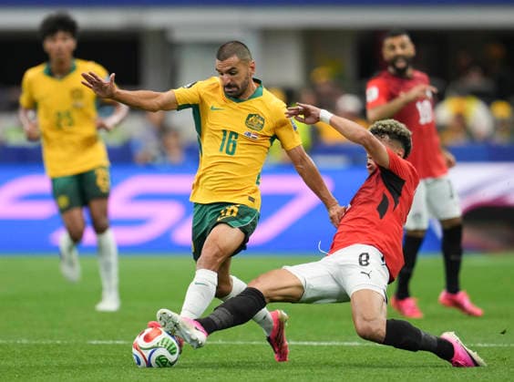 (260704) -- DALLAS, July 4, 2026 -- Aziz Behich (L) of Australia vies with Emam Ashour of Egypt during the round of 32 match between Australia and Egypt at the 2026 FIFA World Cup, WM, Weltmeisterschaft, Fussball at Dallas Stadium in Dallas, the United States, July 3, 2026. ) (SP)U.S.-DALLAS-FOOTBALL-FIFA WORLD CUP-ROUND OF 32-AUS VS EGY WuxXiaoling 