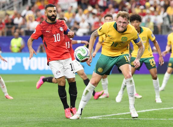(260704) -- DALLAS, July 4, 2026 -- Mohamed Salah (L) of Egypt vies with Harry Souttar of Australia during the round of 32 match between Australia and Egypt at the 2026 FIFA World Cup, WM, Weltmeisterschaft, Fussball at Dallas Stadium in Dallas, the United States, July 3, 2026. ) (SP)U.S.-DALLAS-FOOTBALL-FIFA WORLD CUP-ROUND OF 32-AUS VS EGY LixYing 