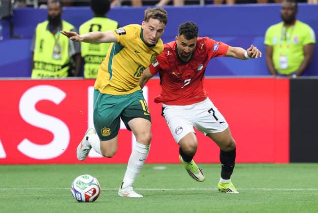 (260704) -- DALLAS, July 4, 2026 -- Mahmoud Trezeguet (R) of Egypt vies with Kai Trewin of Australia during the round of 32 match between Australia and Egypt at the 2026 FIFA World Cup, WM, Weltmeisterschaft, Fussball at Dallas Stadium in Dallas, the United States, July 3, 2026. ) (SP)U.S.-DALLAS-FOOTBALL-FIFA WORLD CUP-ROUND OF 32-AUS VS EGY LixYing 