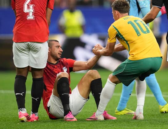 (260704) -- DALLAS, July 4, 2026 -- Ajdin Hrustic (R) of Australia pulls up Ramy Rabia of Egypt during the round of 32 match between Australia and Egypt at the 2026 FIFA World Cup, WM, Weltmeisterschaft, Fussball at Dallas Stadium in Dallas, the United States, July 3, 2026. ) (SP)U.S.-DALLAS-FOOTBALL-FIFA WORLD CUP-ROUND OF 32-AUS VS EGY WuxXiaoling 