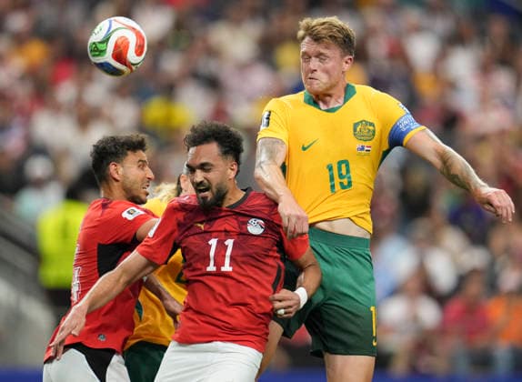(260704) -- DALLAS, July 4, 2026 -- Harry Souttar (R) of Australia jumps for a header against Mostafa Zico of Egypt during the round of 32 match between Australia and Egypt at the 2026 FIFA World Cup, WM, Weltmeisterschaft, Fussball at Dallas Stadium in Dallas, the United States, July 3, 2026. ) (SP)U.S.-DALLAS-FOOTBALL-FIFA WORLD CUP-ROUND OF 32-AUS VS EGY WuxXiaoling 