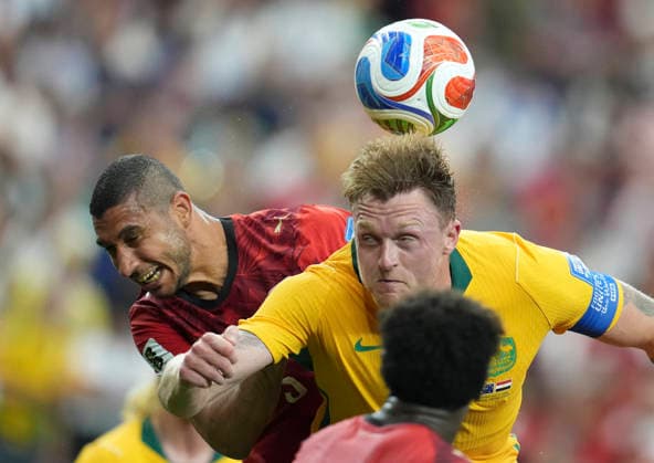 (260704) -- DALLAS, July 4, 2026 -- Harry Souttar (R) of Australia jumps for a header during the round of 32 match between Australia and Egypt at the 2026 FIFA World Cup, WM, Weltmeisterschaft, Fussball at Dallas Stadium in Dallas, the United States, July 3, 2026. ) (SP)U.S.-DALLAS-FOOTBALL-FIFA WORLD CUP-ROUND OF 32-AUS VS EGY WuxXiaoling 