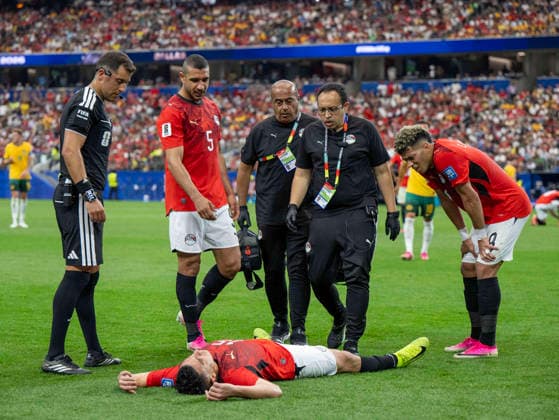 July 3, 2026, Arlington, Texas, USA: Egypt player 15 Def KARIM HAFEZ injured on the pitch with team members 5 Def RAMY RABIA and 8 Mid EMAM ASHOUR assisting and medical staff arriving to render aid World Cup 2026: RD 32: Australia 1:1 Egypt  - ZUMAm147 20260703_zap_m147_006 Copyright: xHossxMcBainx