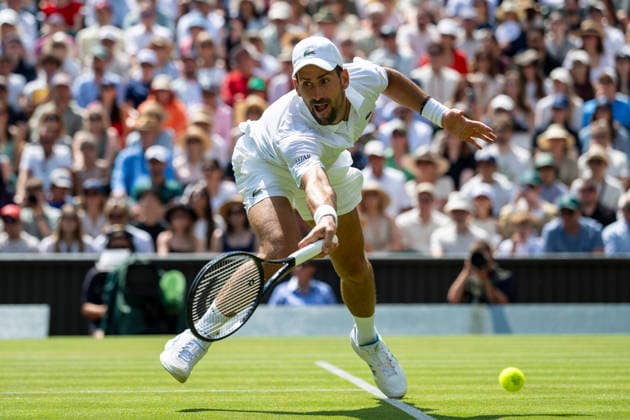 (260704) -- LONDON, July 4, 2026 -- Novak Djokovic of Serbia returns the ball during the men s singles third round match against Arthur Rinderknech of France at the Wimbledon Tennis Championships in London, Britain, on July 3, 2026. (Photo by Xinhua) (SP)BRITAIN-LONDON-TENNIS-WIMBLEDON-MEN S SINGLES StephenxChung 