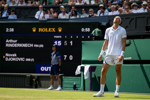 (260704) -- LONDON, July 4, 2026 -- Arthur Rinderknech of France reacts during the men s singles third round match against Novak Djokovic of Serbia at the Wimbledon Tennis Championships in London, Britain, on July 3, 2026. (Photo by Xinhua) (SP)BRITAIN-LONDON-TENNIS-WIMBLEDON-MEN S SINGLES StephenxChung 