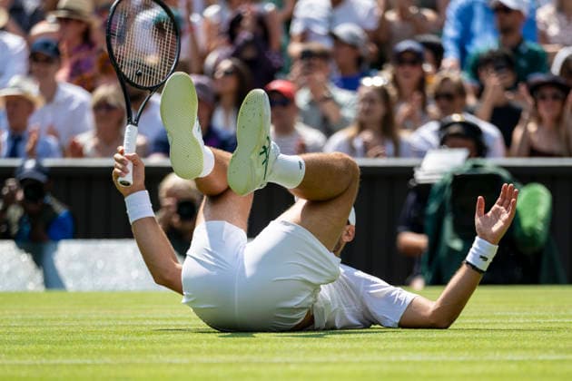 (260704) -- LONDON, July 4, 2026 -- Novak Djokovic of Serbia falls during the men s singles third round match against Arthur Rinderknech of France at the Wimbledon Tennis Championships in London, Britain, on July 3, 2026. (Photo by Xinhua) (SP)BRITAIN-LONDON-TENNIS-WIMBLEDON-MEN S SINGLES StephenxChung 