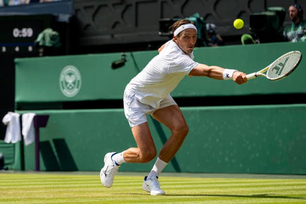 (260704) -- LONDON, July 4, 2026 -- Arthur Rinderknech of France returns the ball during the men s singles third round match against Novak Djokovic of Serbia at the Wimbledon Tennis Championships in London, Britain, on July 3, 2026. (Photo by Xinhua) (SP)BRITAIN-LONDON-TENNIS-WIMBLEDON-MEN S SINGLES StephenxChung 