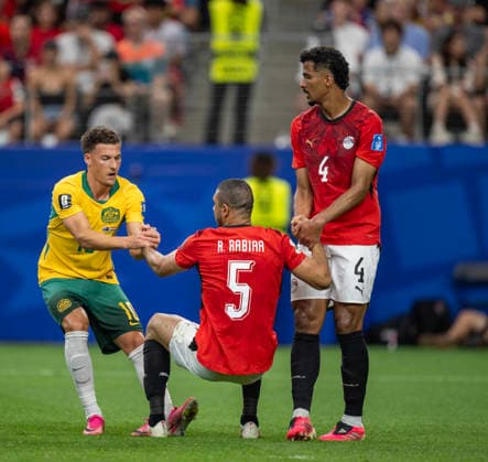 July 3, 2026, Arlington, Texas, USA: Australia player 10 Mid AJDIN HRUSTIC showing good sportsmanship helping Egypt player 5 Def RAMY RABIA and 4 Def HOSSAM ABDELMAGUID on the pitch World Cup 2026: RD 32: Australia 4:2 Egypt  - ZUMAm147 20260703_zap_m147_033 Copyright: xHossxMcBainx