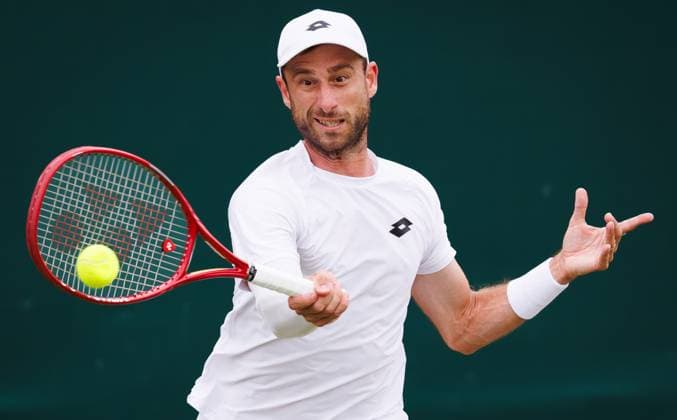 Belgian Sander Gille pictured in action during a doubles tennis match between Argentinian-Spain pair Zeballos - Granollers and Belgian-Dutch pair Gille-Verbeek, in the second round of the Men s doubles at the Wimbledon grand slam tennis tournament in London, Britain, Saturday 04 July 2026. BENOITxDOPPAGNE  x180331486x