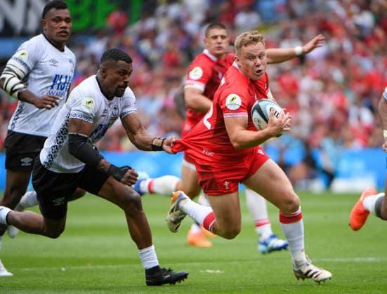 RECORD DATE NOT STATED 4th July 2026; Cardiff City Stadium, Cardiff, Wales; 2026 Nations Championship Rugby, Fiji versus Wales; Sam Costelow of Wales on the ball being tackled by Jiuta Wainiqolo of Fiji AledxHopkins