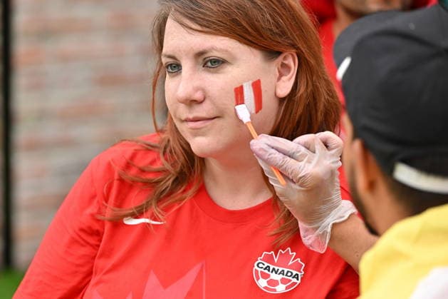 July 4, 2026, Toronto, On, Canada: A fan gets her face painted with Team Canada colours prior to the start of Canada s World Cup soccer match against Morocco at FIFA Fan Fest in Toronto on Saturday, July 4, 2026. Canada News - July 4, 2026  - ZUMAc35_ 20260704_zaf_c35_002 Copyright: xJonxBlackerx