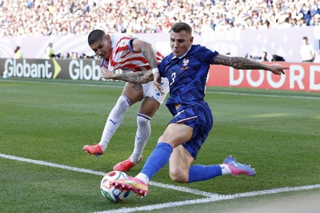 PHILADELPHIA - Juan Jose Caceres of Paraguay and Lucas Digne of France during the 2026 FIFA World Cup, WM, Weltmeisterschaft, Fussball round of 16 match between Paraguay and France at the Philadelphia Stadium on July 4, 2026, in Philadelphia, United States. MAURICE VAN STEEN ANP FIFA World Cup 2026 - round of 16 2026 xVIxANPxSportx xMauricexvanxSteenxIVx 562816687 originalFilename: 562816687.jpg