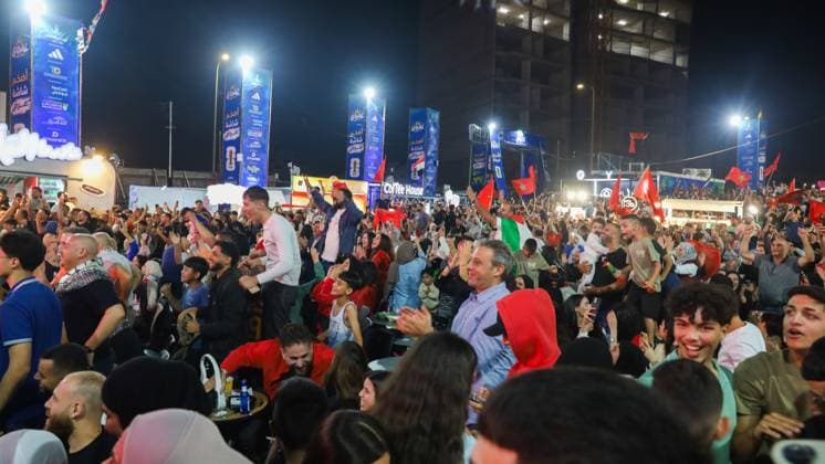 Palestinians Gather in Al-Bireh to Support Morocco in World Cup Match AL-BIREH, WEST BANK JULY 4, 2026: Palestinians gather at a public World Cup fan zone in Al-Bireh, near Ramallah, to watch and support Morocco during its FIFA World Cup, WM, Weltmeisterschaft, Fussball 2026 Round of 16 match against Canada. The event was attended by Palestinian Football Association President Jibril Rajoub, representatives of the Moroccan Embassy to Palestine and other public figures. Fans watched the match on a giant outdoor screen in an atmosphere of celebration and support for the Moroccan national team, Nationalteam Al-Bireh Palestine, State of Copyright: x xSalmanxMohsenxAlkhatibx xJNAxPressx