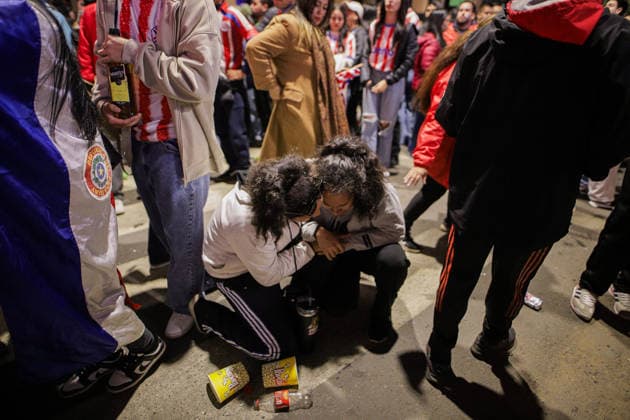 Paraguay football team supporters in Asuncion watch FIFA World Cup, WM, Weltmeisterschaft, Fussball 2026 - Round of 16 ASUNCION, PARAGUAY – JULY 4: A woman comforts another woman after France s victory at a street in downtown Asuncion during the FIFA World Cup Round of 16, in Asuncion, Paraguay, on July 4, 2026. Nathalia Aguilar Anadolu Asuncion Paraguay. Editorial use only. Please get in touch for any other usage.  Copyright: x2026xAnadoluxNathaliaxAguilarx