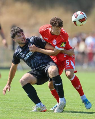Fußball - Testspiel - TSG Pfeddersheim - 1. FSV Mainz 05 - 04.07.26, Tim Keller (TSG), Eric Martel (Mainz), - *** Soccer Friendly Match: TSG Pfeddersheim 1, FSV Mainz 05, April 7, 2026; Tim Keller (TSG), Eric Martel (Mainz),
