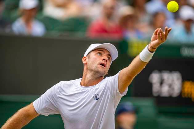 RECORD DATE NOT STATED 5th July 2026; All England Lawn Tennis and Croquet Club, London, England; Wimbledon Tennis Tournament, Day Seven; Patrik Riki (CZE) serves in his third round match with Adam Pavlasek (CZE) against Harri Heliovaara (FIN) and Henry Patten (GBR) GodfreyxPitt