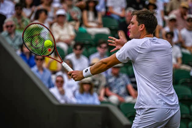 RECORD DATE NOT STATED 5th July 2026; All England Lawn Tennis and Croquet Club, London, England; Wimbledon Tennis Tournament, Day Seven; Henry Patten (GBR) plays a volley in his third round match with Harri Heliovaara (FIN) against Adam Pavlasek (CZE) and Patrik Riki (CZE) GodfreyxPitt
