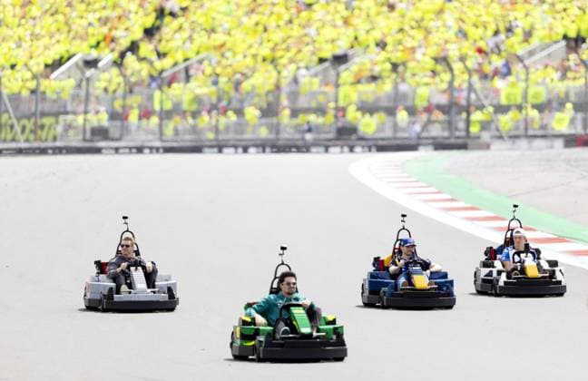 SILVERSTONE - (l-r) Nico Hülkenberg (Audi), Lance Stroll (Aston Martin), Max Verstappen (Red Bull Racing) and Liam Lawson (Racing Bulls) in a LEGO kart during the drivers parade at the Silverstone circuit for the British Grand Prix. SANDER KONING ANP xVIxANPxSportx xxANPxIVx 562860349 originalFilename: 562860349.jpg