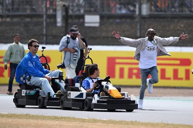 RECORD DATE NOT STATED 5th July 2026; Silverstone Circuit, Northamptonshire, England; FIA Formula 1 2026 British F1 Grand Prix; Race Day; George Russell of Mercedes and Arvid Lindblad of Racing Bulls are joined by Mo Farrah during the lego car race SimonxWest
