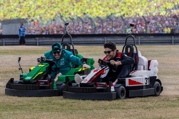 RECORD DATE NOT STATED 5th July 2026; Silverstone Circuit, Northamptonshire, England; FIA Formula 1 2026 British F1 Grand Prix; Race Day; Aston Martin Aramco F1 Team driver Fernando Alonso and TGR Haas F1 Team driver Esteban Ocon on the grass in their Lego Go-Karts TimxWilliams