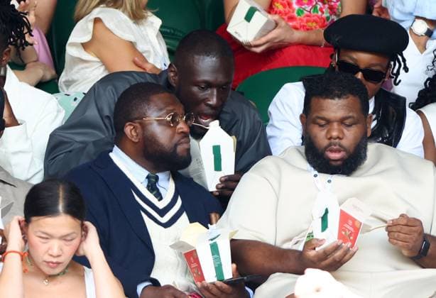 Stormzy and Little Simz eating strawberries watching the action on Centre Court Wimbledon Tennis Championships, Day 7, The All England Lawn Tennis and Croquet Club, London, UK - 05 Jul 2026London The All England Lawn Tennis and United Kingdom  Copyright: xKieranxMcManus Shutterstockx 16976813by