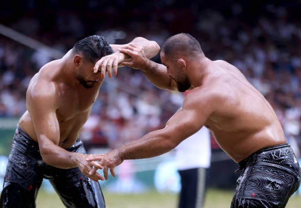 665th Historic Kirkpinar Oil Wrestling Festival in Turkiye s Edirne EDIRNE, TURKIYE - JULY 5: Feyzullah Akturk and Mustafa Tas compete during semifinal match of the 665th Historic Kirkpinar Oil Wrestling Festival at the Sarayici Er Meydani wrestling grounds in Edirne, Turkiye, on July 5, 2026. Ozgun Tiran Anadolu Edirne Turkey. Editorial use only. Please get in touch for any other usage.  Copyright: x2026xAnadoluxOzgunxTiranx