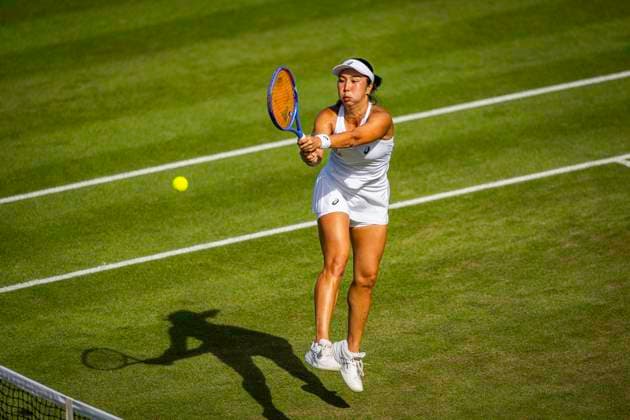 RECORD DATE NOT STATED 5th July 2026; All England Lawn Tennis and Croquet Club, London, England; Wimbledon Tennis Tournament, Day Seven; Aldila Sutjadi (INA) plays a backhand in her second round match with Guido Andreozzi (ARG) against JJ Tracy (USA) and Anna Danilina (KAZ) GodfreyxPitt