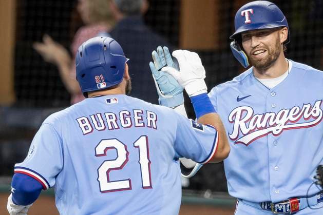 July 5, 2026, Arlington, Texas, USA: Texas Rangers right fielder BRANDON NIMMO (24) congratulates Texas Rangers first baseman JAKE BURGER (21) after hitting a homerun during a MLB, Baseball Herren, USA game between the Detroit Tigers and Texas Rangers at Globe Life Field. Tigers win 6-3. Arlington USA - ZUMAf180 20260705_zsp_f180_007 Copyright: xMarkxFannx