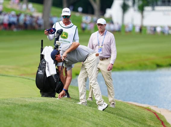 SILVIS, IL - JULY 05: PGA, Golf Herren golfer Beth Kohles who was tied with the lead going into the 18th hole gets a ruling on where to take his drop after his 2nd shot entered the water on the 18th hole during the final round of the John Deere Classic on July 5, 2026, at TPC Deere Run in Silvis, Illinois. (Photo by Brian Spurlock Icon Sportswire) GOLF: JUL 05 PGA John Deere Classic EDITORIAL USE ONLY Icon26070573