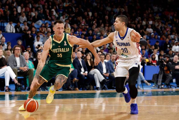 BASKETBALL AUSTRALIA PHILIPPINES, Mitch Creek of the Australian Boomers drives past Mike Phillips of the Philippines during the World Cup qualifier basketball match between Australia and the Philippines at RAC Arena in Perth, Monday, July 6, 2026. ( NO ARCHIVING, EDITORIAL USE ONLY PERTH WESTERN AUSTRALIA AUSTRALIA  Copyright: xRICHARDxWAINWRIGHTx 20260706199229685740