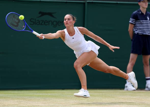 6th July 2026; All England Lawn Tennis and Croquet Club, London, England; Wimbledon Tennis Tournament, Day Eight; Marta Kostyuk (UKR) with a forehand shot to Ashlyn Krueger (USA) JohnxPatrickxFletcher