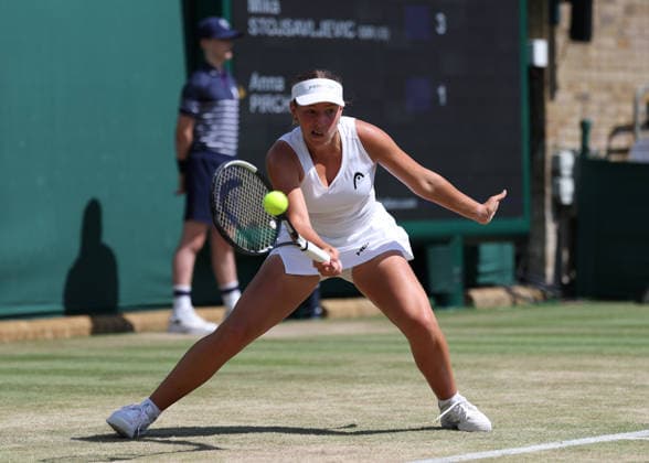 6th July 2026; All England Lawn Tennis and Croquet Club, London, England; Wimbledon Tennis Tournament, Day Eight; Anna Bircher (AUS) with a forehand shot to Mika Stojsavljevic (GBR) JohnxPatrickxFletcher