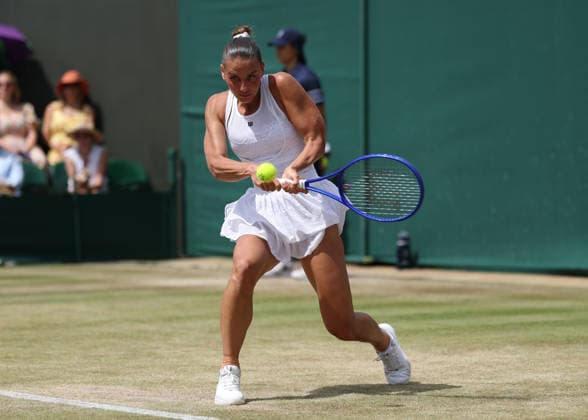 6th July 2026; All England Lawn Tennis and Croquet Club, London, England; Wimbledon Tennis Tournament, Day Eight; Marta Kostyuk (UKR) with a backhand shot to Ashlyn Krueger (USA) JohnxPatrickxFletcher